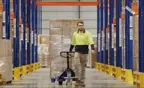 Man in warehouse aisle