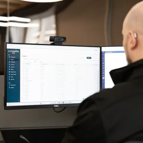 Crossfire team member looking at Crossfire Portal